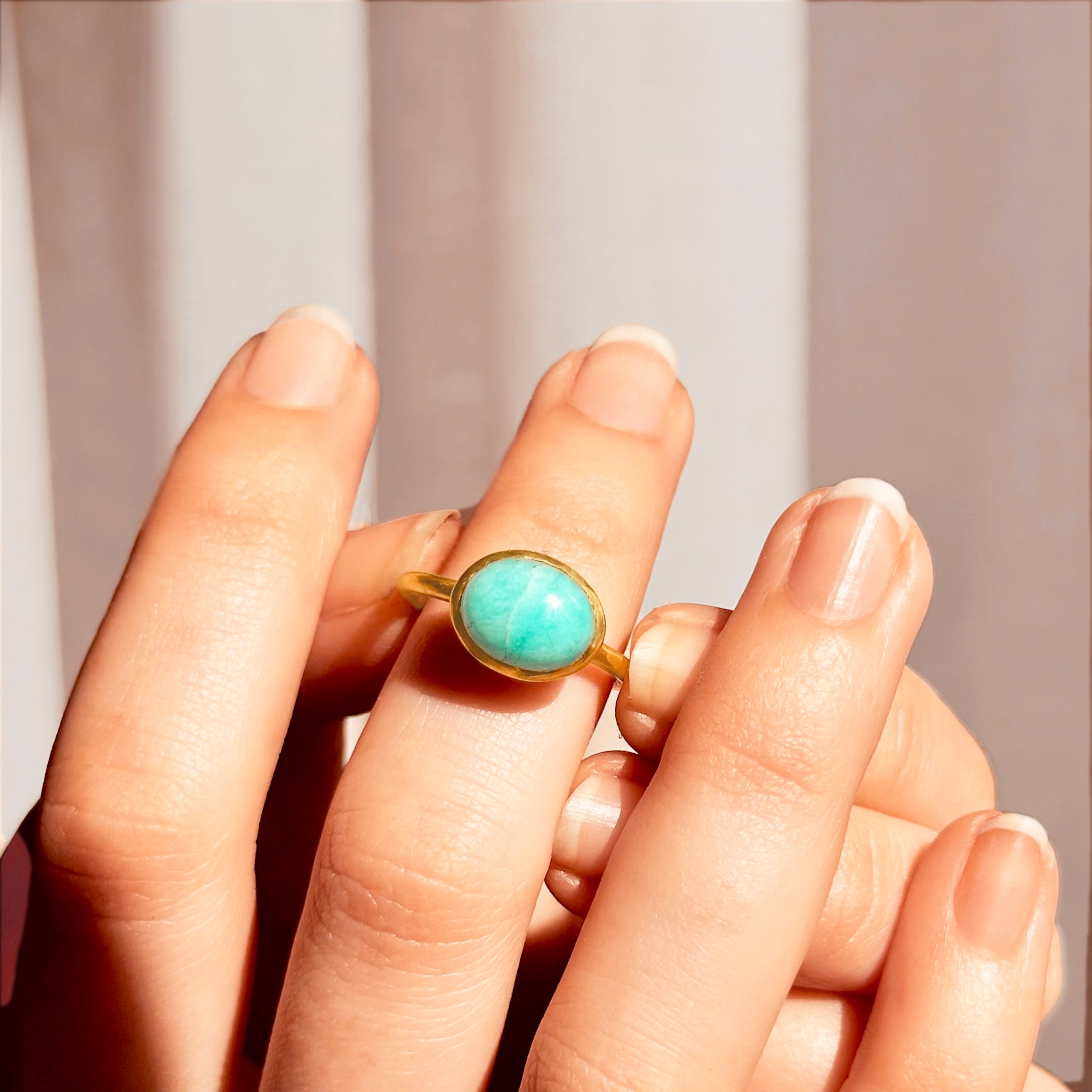 Model with french manicure wears a vermeil gold plated sterling silver oval solitaire ring bezel set with amazonite. Purple Turquoise Ring, Gold Turquoise Ring, Turquoise Stacking Ring, Turquoise Statement Ring Spring ring