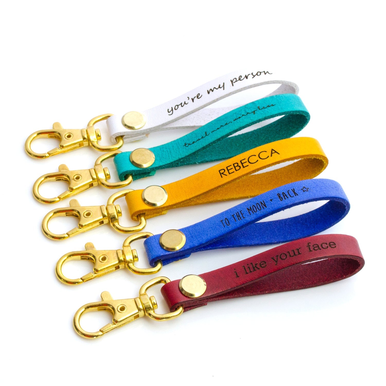 Five colorful leather keychains with lobster clasp in nude, turquoise, butternut, cobalt blue and plum with custom engraving