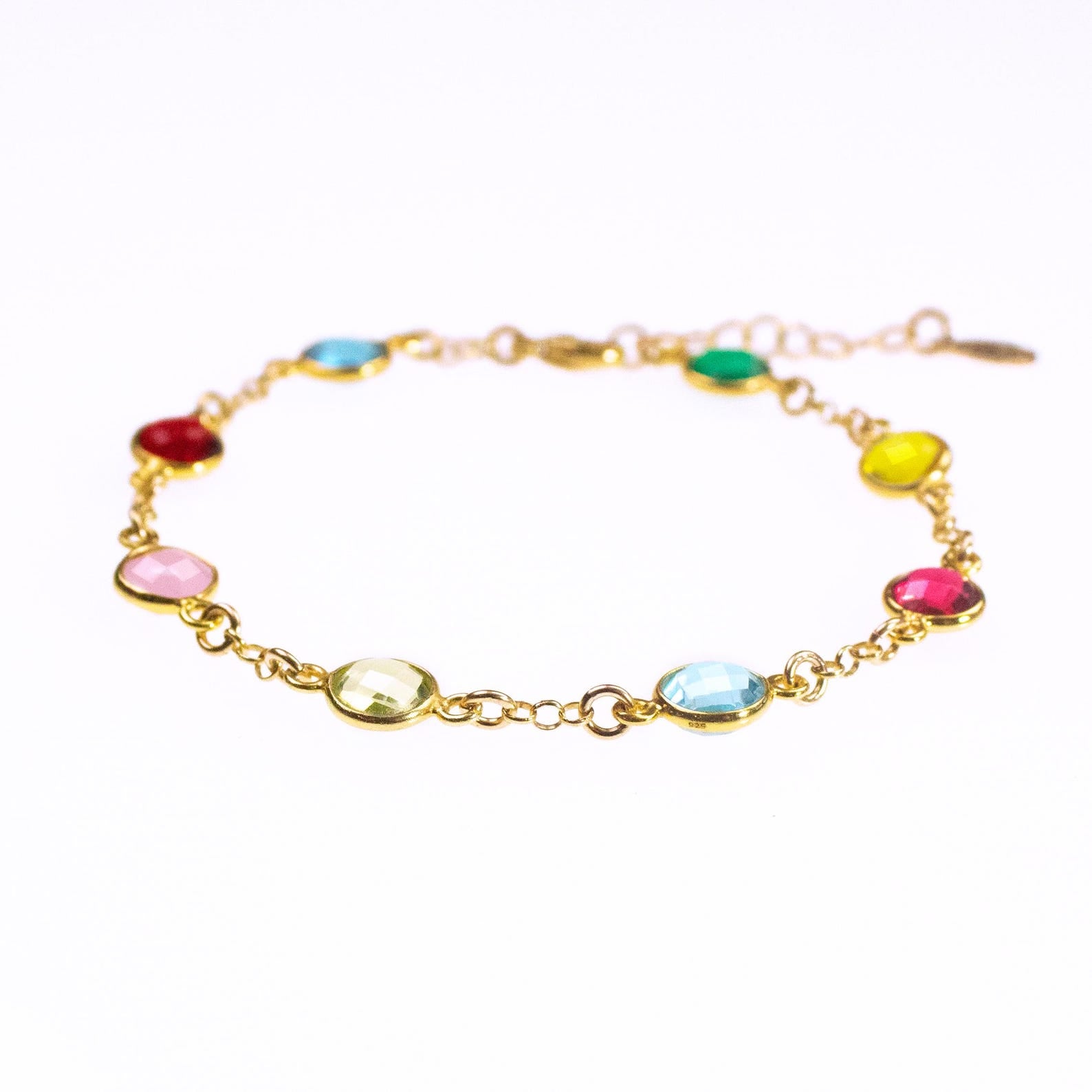 Gold filled station bracelet friendship bracelet taylor swift inspired music lover. Side view with eight gemstones including kyanite, garnet, pink chalcedony, peridot, blue topaz, ruby, citrine and green onyx. Birthstone bracelet, birthstone jewelry