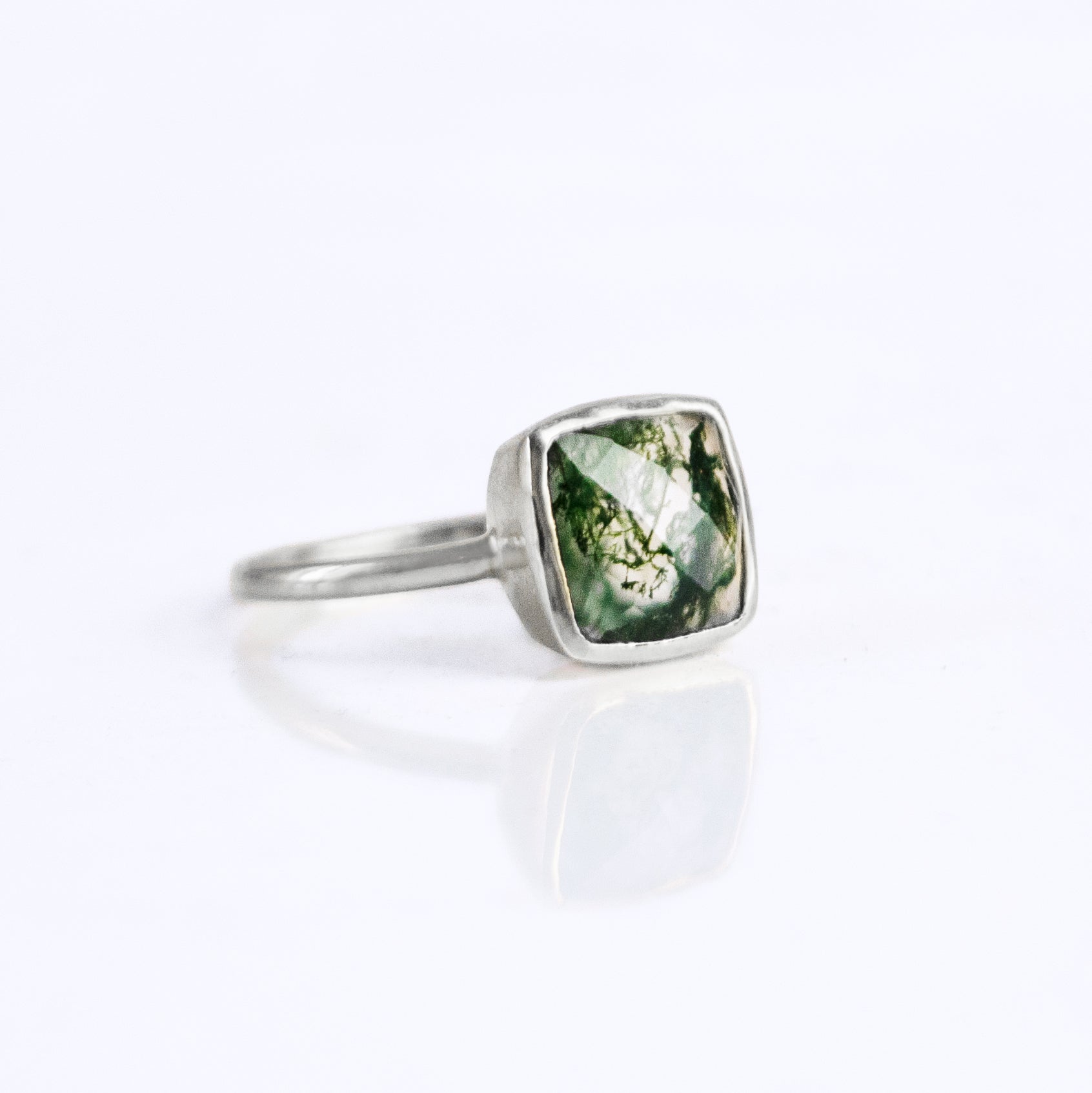 Sterling silver Moss Agate cushion bezel square stacking ring on white background. Green ring, green gemstone, green birthstone, moss ring