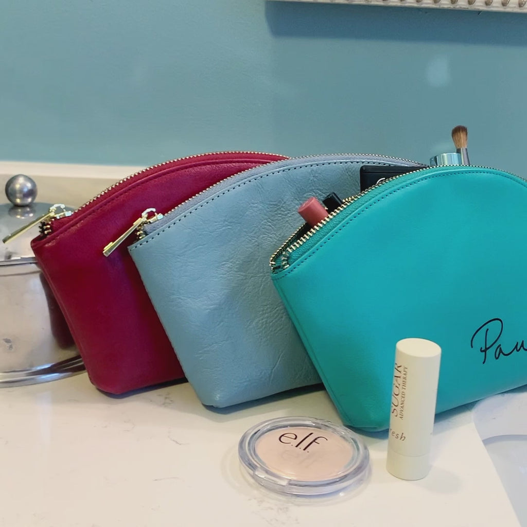 personalized cosmetic bag, personalized toiletry bags. Three every day cosmetic bag, pouch, accessory bags. One burgundy, silver-gray and one turquoise bag with engraved script font paula. celebrate someone's birthday, mother's day, holiday or any celebration with these custom cosmetic toiletry bags