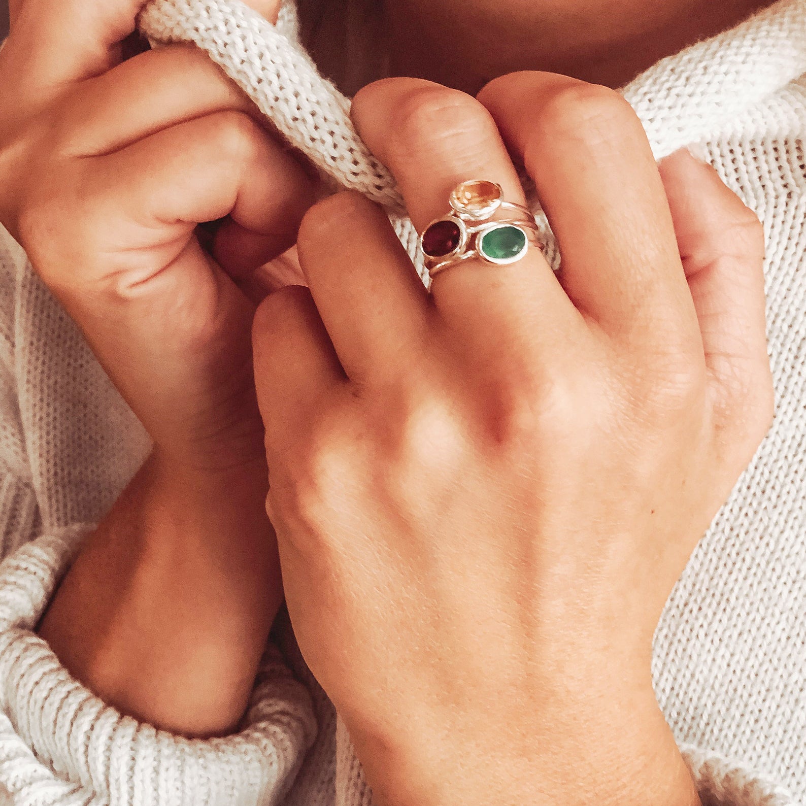 small-oval-rings-on-hand-stacking.jpg