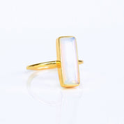 Iridescent Opalite ring, alternative October birthstone, unique gemstone jewelry, Opalite bar design, minimalist iridescent ring, bezel-set Opalite, Adira Series, fashionable Opalite ring, elegant gemstone accessory, eye-catching jewelry