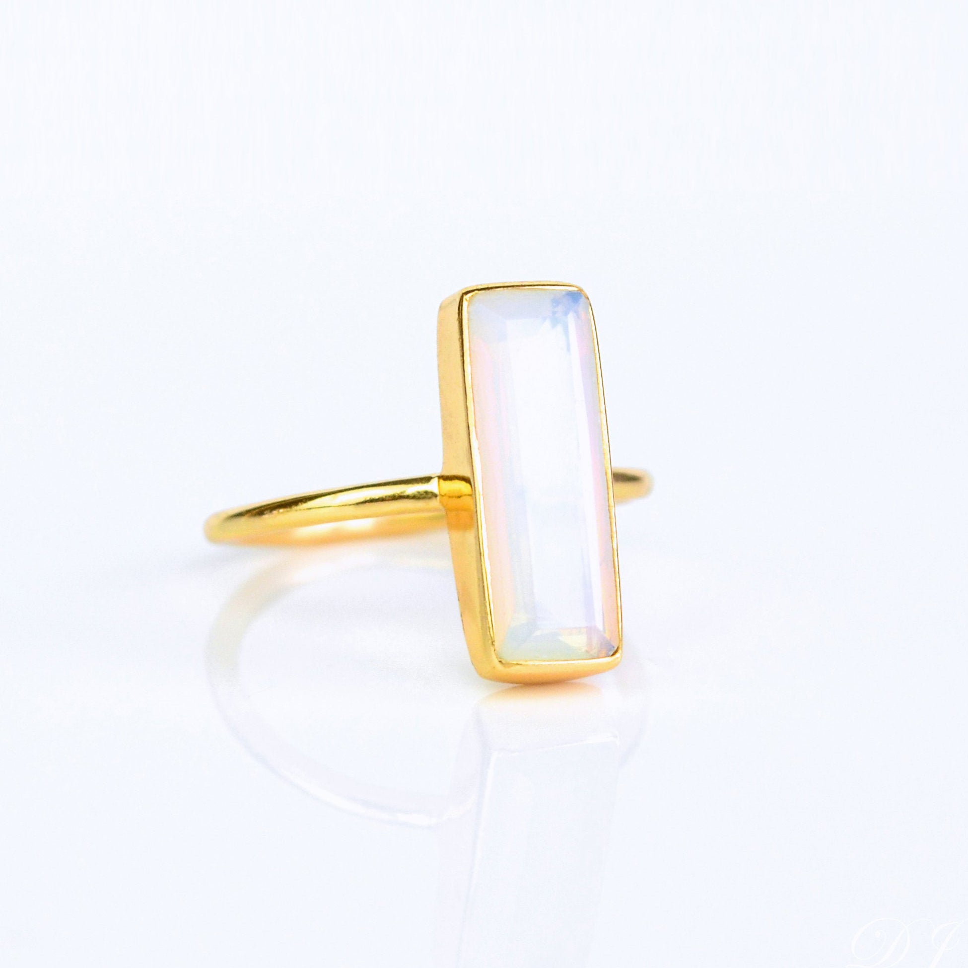 Iridescent Opalite ring, alternative October birthstone, unique gemstone jewelry, Opalite bar design, minimalist iridescent ring, bezel-set Opalite, Adira Series, fashionable Opalite ring, elegant gemstone accessory, eye-catching jewelry