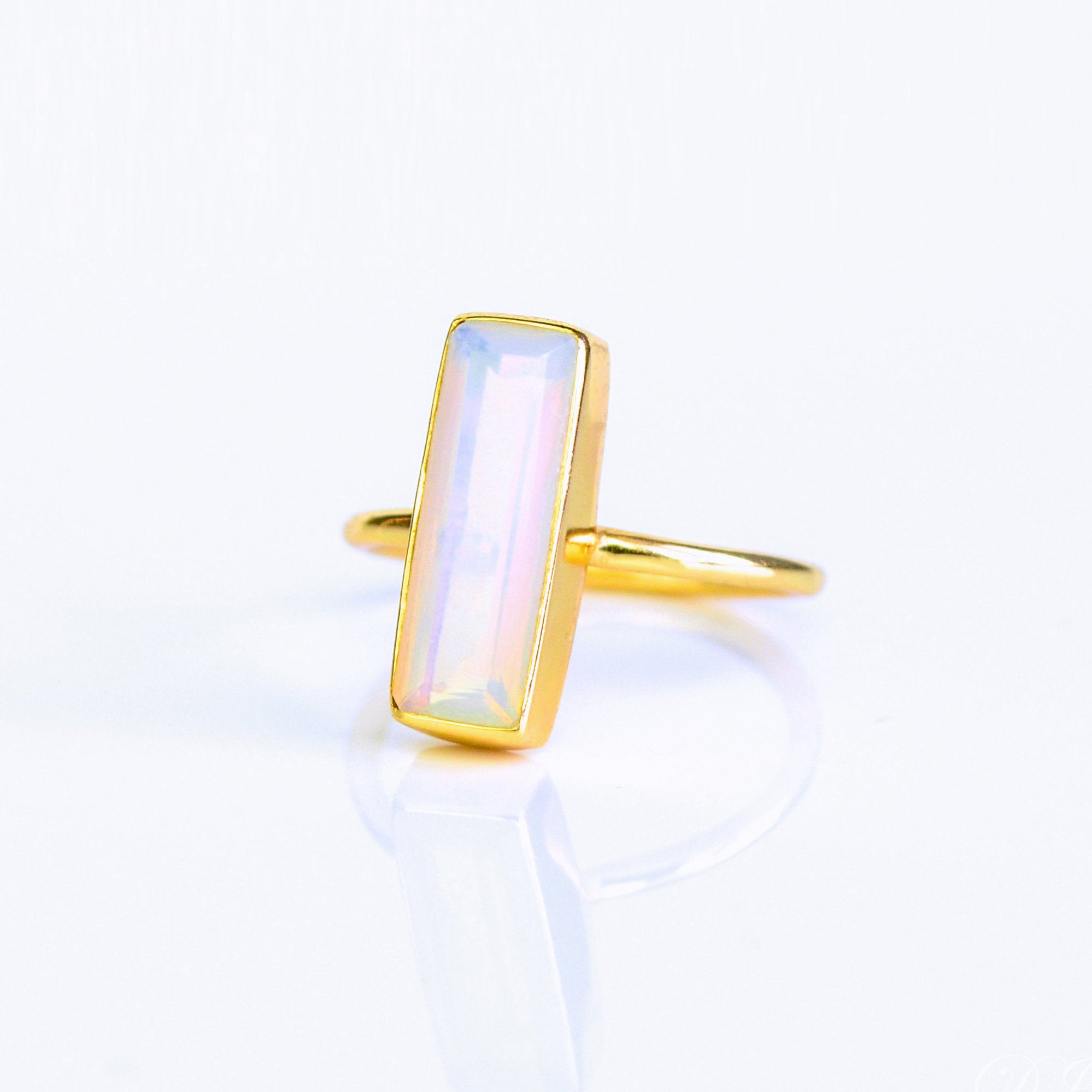 Opalite bar ring, October birthstone alternative, iridescent gemstone, unique Opalite jewelry, minimalist design, bezel-set iridescent ring, Adira Series, eye-catching Opalite, elegant gemstone ring, stylish Opalite accessory