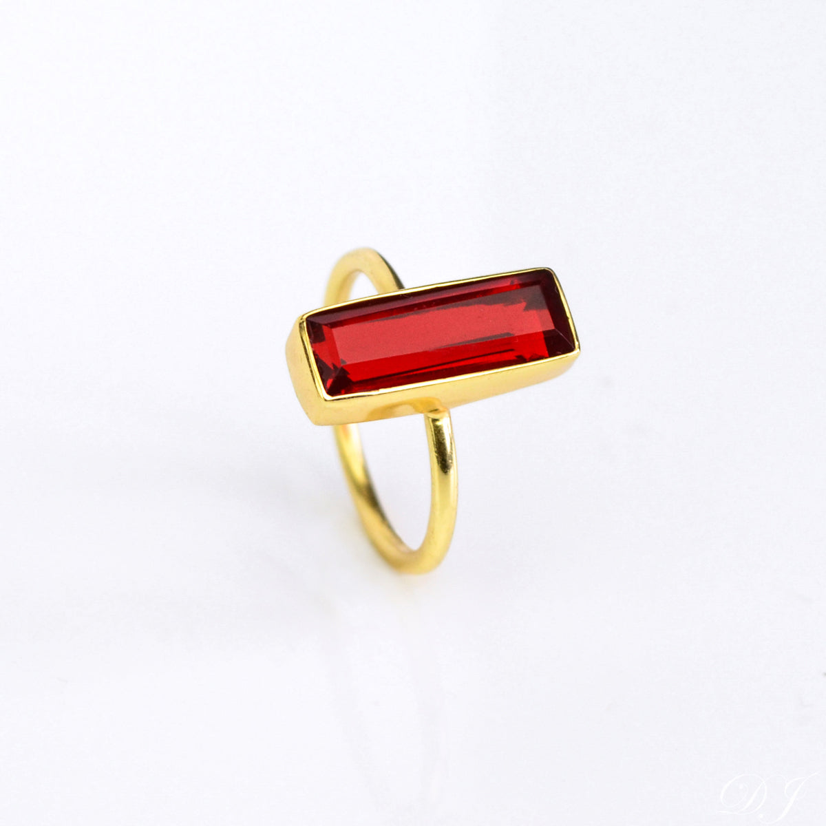 A gold garnet gemstone bar ring January birthstone. Garnet bar ring, gold gemstone ring, handcrafted January birthstone jewelry, deep red garnet, minimalist ring, garnet and silver band, garnet in rose gold, bohemian style, artisan garnet ring, stacking gemstone ring, elegant garnet jewelry, garnet accessory