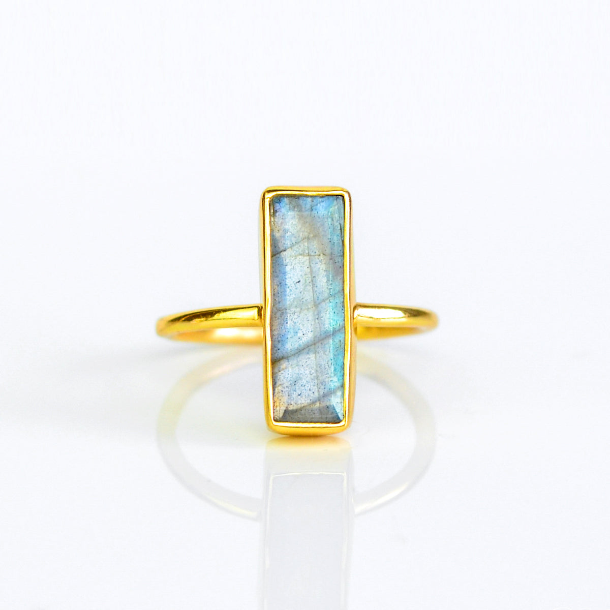 Iridescent Labradorite ring, natural gemstone jewelry, Labradorite bar design, unique iridescent ring, minimalist labradorite, bezel-set stone, Adira Series, fashionable labradorite ring, elegant gemstone, eye-catching jewelry