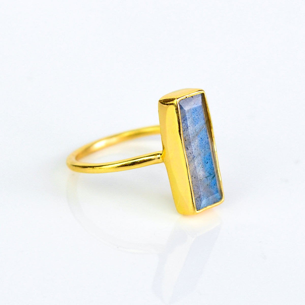 Labradorite bar ring, iridescent gemstone, unique labradorite jewelry, minimalist design, bezel-set labradorite, Adira Series, eye-catching iridescent ring, elegant labradorite, stylish gemstone ring, fashion-forward labradorite accessory