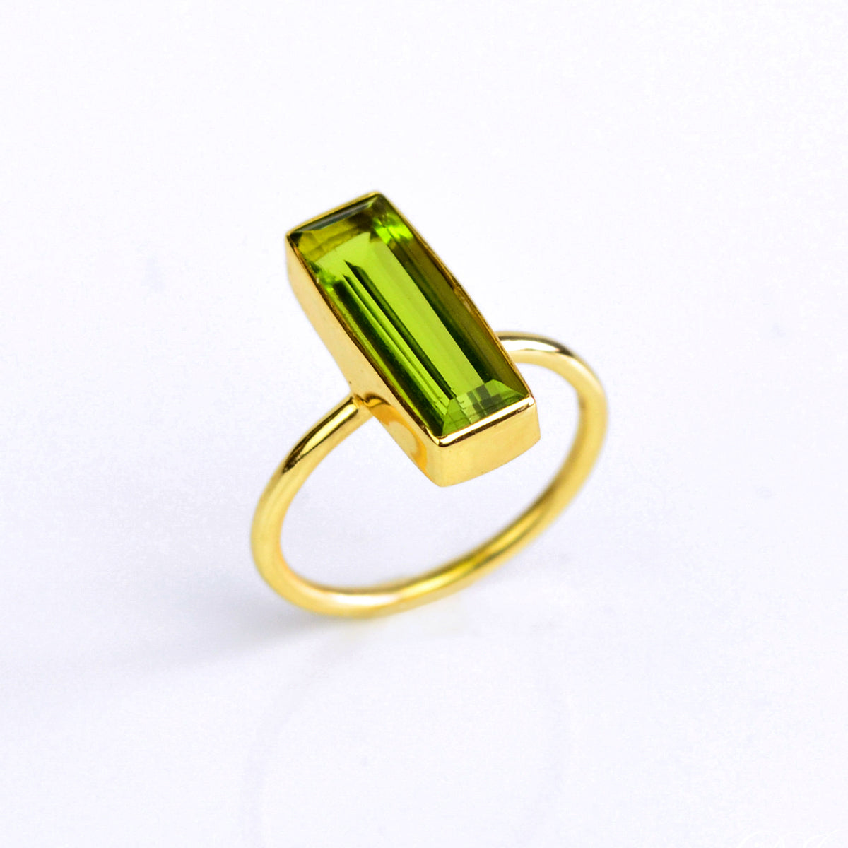 Peridot ring, August birthstone jewelry, vibrant green gemstone, unique Peridot bar ring, minimalist design, bezel-set Peridot, Adira Series, eye-catching Peridot ring, stylish green gemstone, elegant Peridot accessory