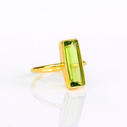 Peridot bar ring, August birthstone, vibrant green gemstone, unique Peridot design, minimalist ring, bezel-set gemstone, Adira Series, eye-catching green Peridot, elegant jewelry, stylish Peridot accessory