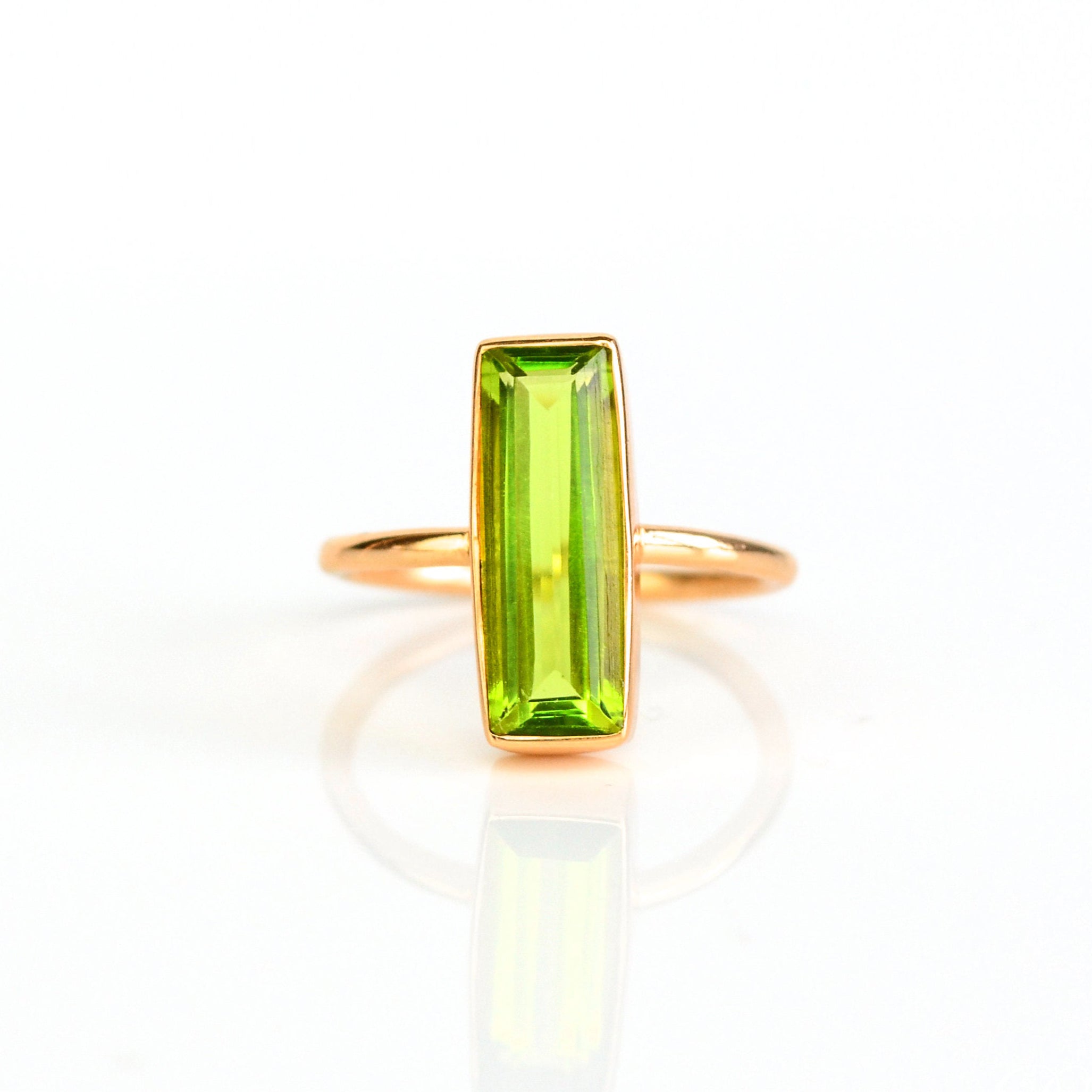 Natural Peridot jewelry, August birthstone ring, vibrant green Peridot bar style, minimalist design, bezel-set Peridot, Adira Series, unique green gemstone, eye-catching jewelry, elegant Peridot ring, stylish gemstone accessory