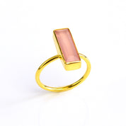 Pink Chalcedony ring, October birthstone alternative, soft pink gemstone jewelry, unique Chalcedony bar ring, minimalist design, bezel-set Pink Chalcedony, Adira Series, eye-catching pink gemstone, stylish jewelry, elegant pink Chalcedony