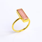 Natural Pink Chalcedony jewelry, October birthstone alternative, soft pink gemstone ring, bar style Chalcedony, minimalist design, bezel-set Pink Chalcedony, Adira Series, unique pink jewelry, eye-catching accessory, elegant Chalcedony ring