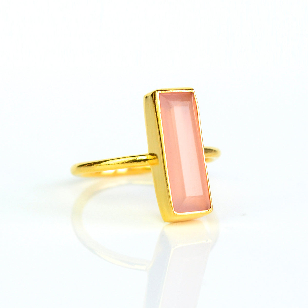 Pink Chalcedony bar ring, October birthstone jewelry, soft pink Chalcedony gemstone, unique design, minimalist ring, bezel-set stone, Adira Series, stylish pink Chalcedony, elegant jewelry, eye-catching gemstone accessory