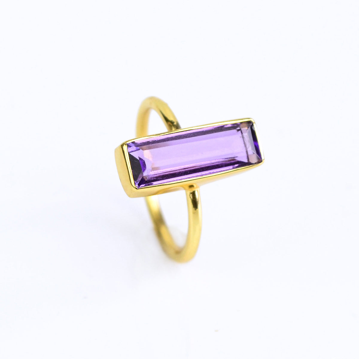 Amethyst gemstone ring, February birthstone, vibrant purple Amethyst, unique bar design, minimalist Amethyst ring, bezel-set gemstone, Adira Series, fashionable purple jewelry, elegant Amethyst ring, eye-catching accessory