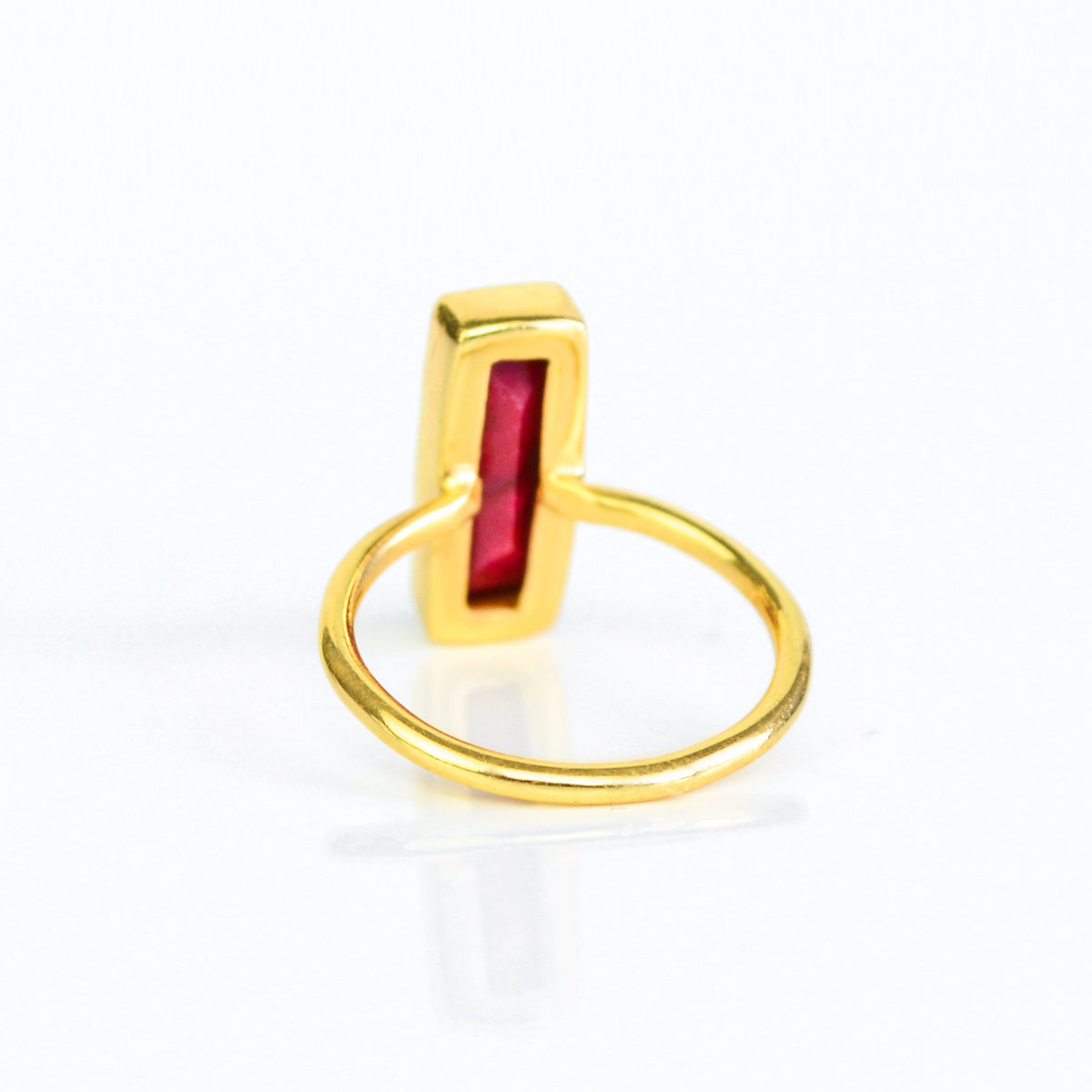 July birthstone ring, Ruby gemstone, striking red Ruby bar design, unique minimalist ring, bezel-set Ruby, Adira Series, eye-catching red jewelry, elegant Ruby, stylish gemstone accessory, fashion-forward Ruby ring