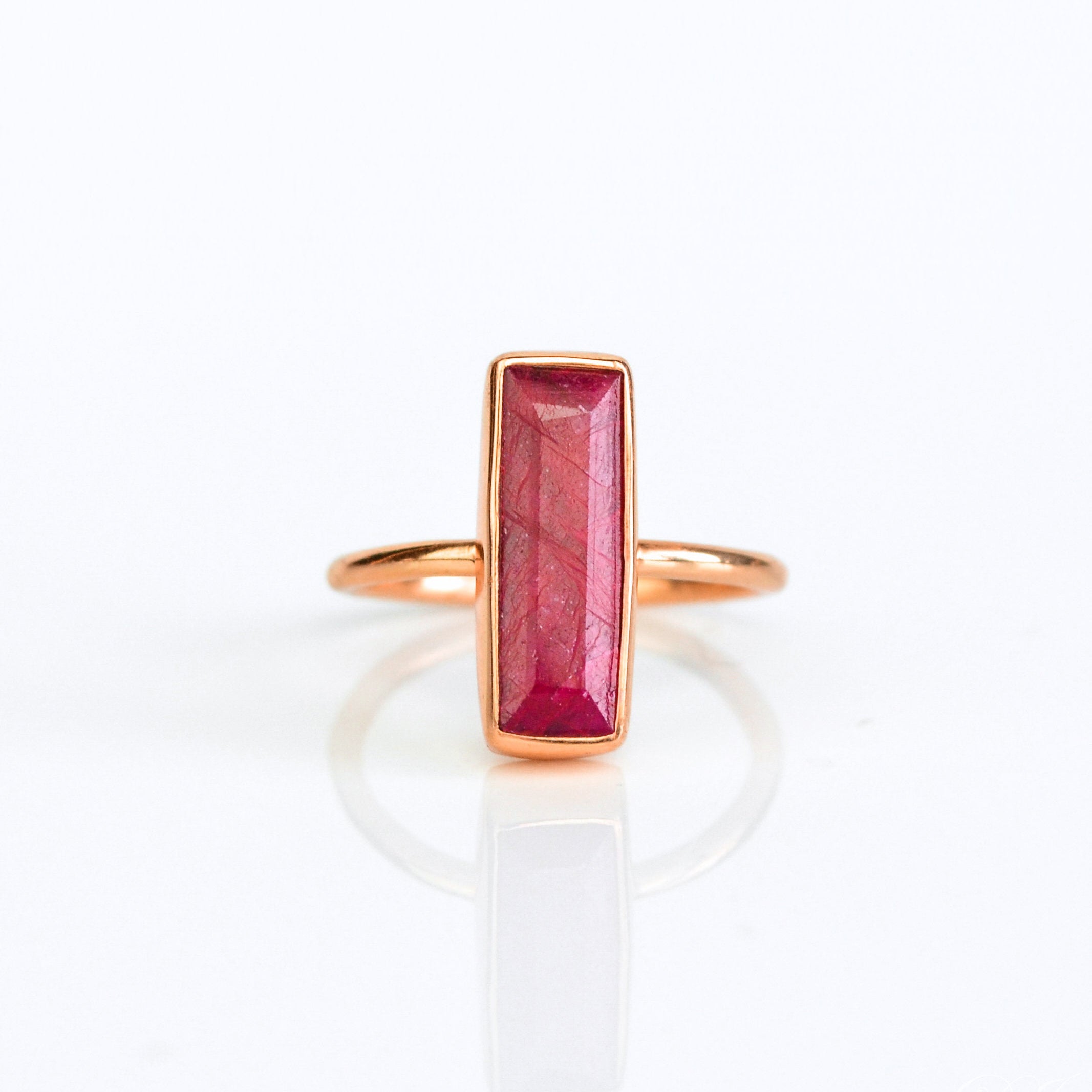 Ruby gemstone ring, July birthstone, striking red Ruby, unique bar design, minimalist Ruby ring, bezel-set gemstone, Adira Series, fashionable red jewelry, elegant Ruby ring, eye-catching accessory