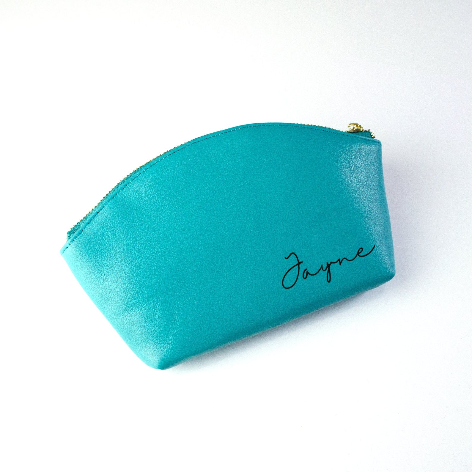 Turquoise bag with engraved script font. Celebrate someone's birthday, mother's day, holiday or any celebration with these custom cosmetic toiletry bags