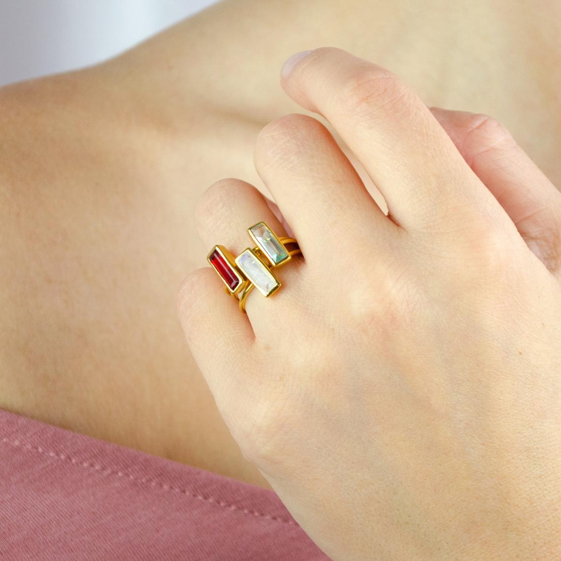 A hand wears a set of 3 tiny adira rings. Tiny Adira gemstone bar ring, small gemstone ring, silver bar ring, gold bar ring, rose gold bar ring, dainty gemstone ring, birthstone ring, minimalist jewelry, chic bar ring, custom gemstone ring, delicate fashion ring, elegant gemstone accessory