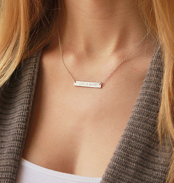 A person in a tan shirt wears a bar necklace. Custom engraved pet bar necklace, sterling silver pet keepsake, gold-filled bar necklace, rose gold pet necklace, personalized pet loss jewelry, pet memorial gift, dog lover necklace, pet owner gift, pet name necklace, engraved front or back, pet remembrance charm