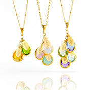 Three Family Tree Necklaces in 18k Vermeil Gold with Two, Three, and Four Cascading Teardrop Shape Prong Gemstones with Personalized Oval Tag Charms