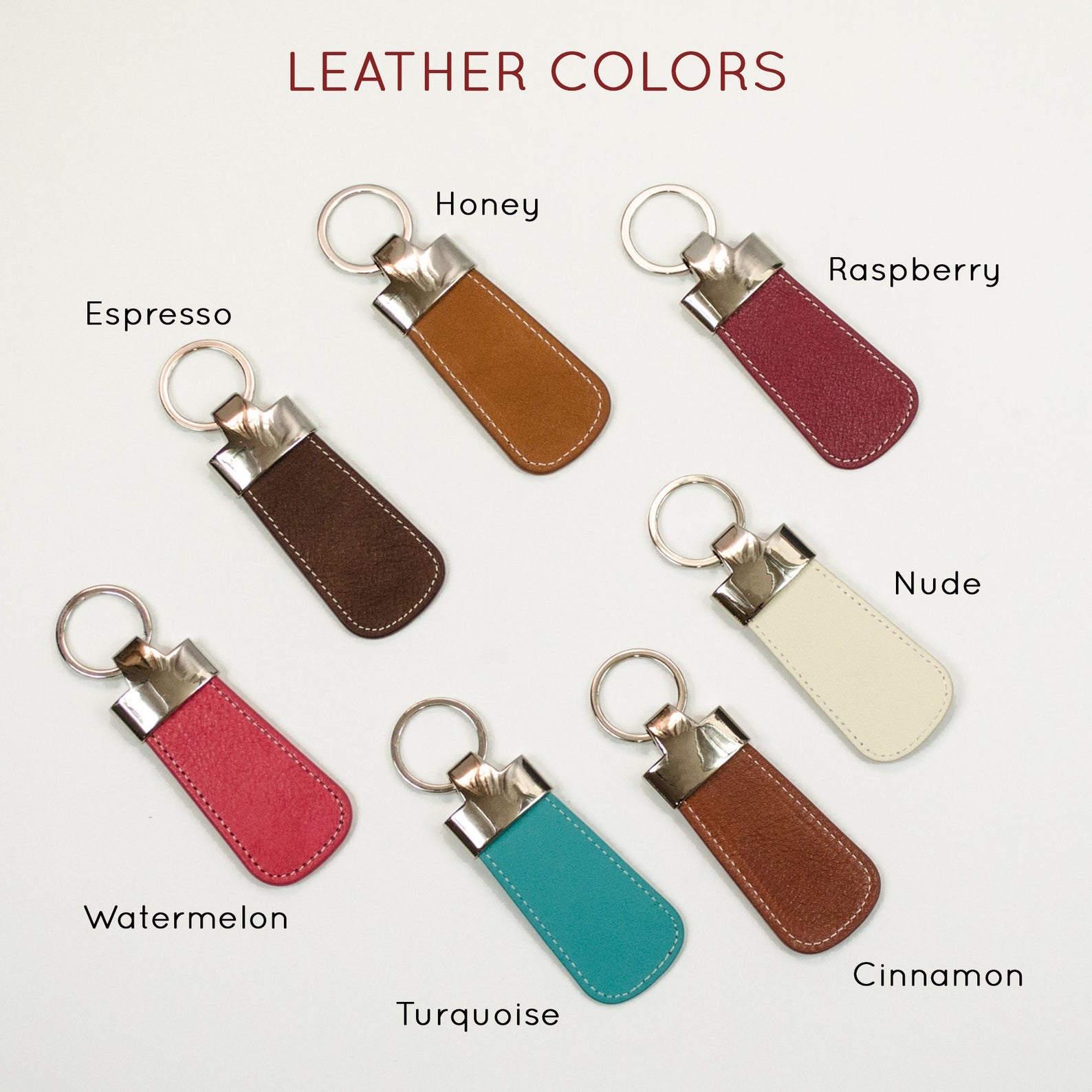 Available leather color options for the paddle keychain are honey, espresso, watermelon, raspberry, nude, cinnamon and turquoise.