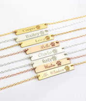 Multiple paw print bar necklaces in a variety of fonts. Pet memorial bar necklace, engraved pet jewelry, custom pet name necklace, sterling silver bar necklace, gold-filled pet necklace, rose gold-filled necklace, personalized pet remembrance gift, dog mom gift, pet owner jewelry, pet tribute necklace, engraved pet charm