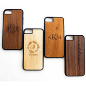 Custom engraved personalized wood phone cases available in birch, ebony, mahogany, cedar, and afromosia. These cases highlight our elegance, wreath and timeless monograms.