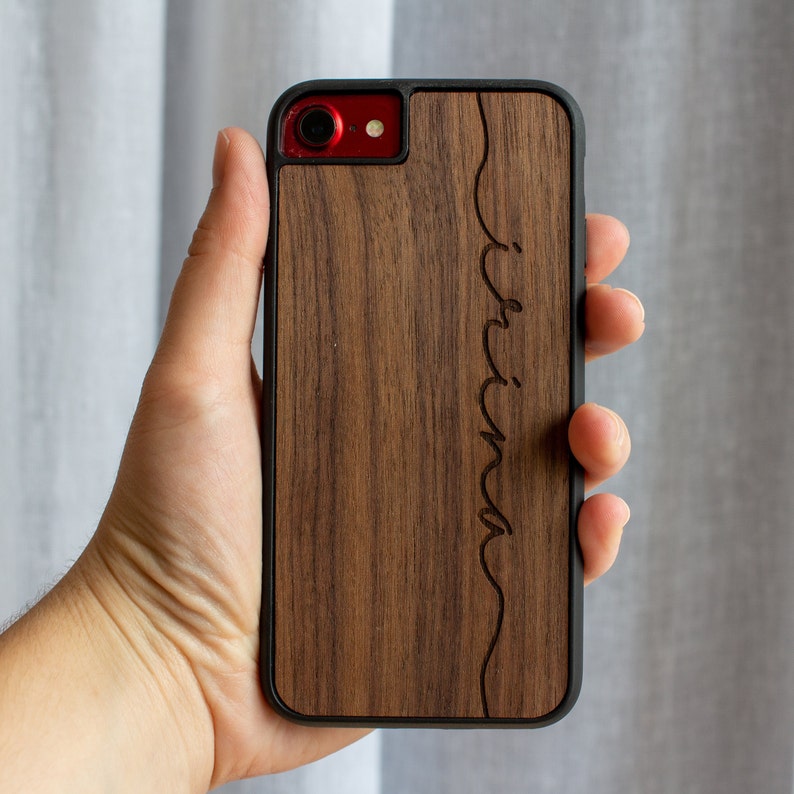 Wood veneer phone case with custom engraved name.