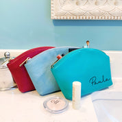 Three every day cosmetic bag, pouch, accessory bags. One burgundy, silver-gray and one turquoise bag with engraved script font paula. celebrate someone's birthday, mother's day, holiday or any celebration with these custom cosmetic toiletry bags