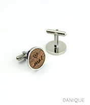 One pair of walnut cufflinks with custom handwriting from a photograph with silver base. 