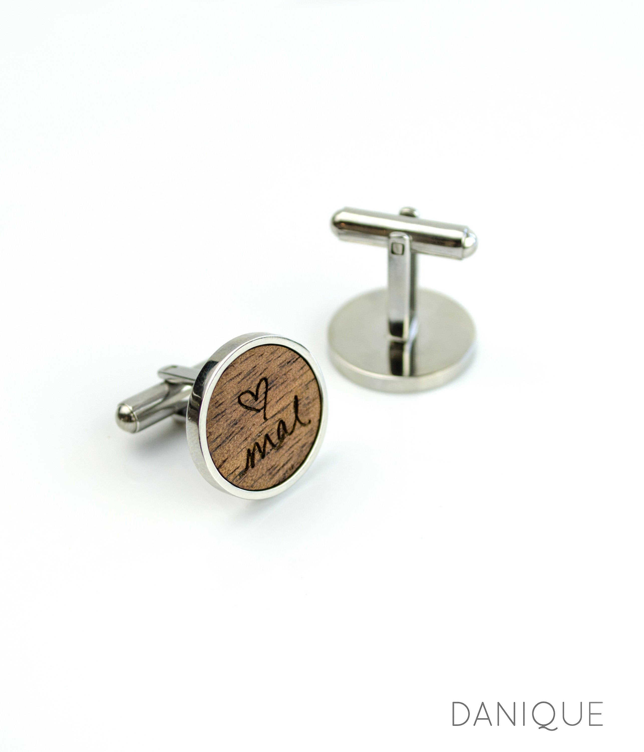 One pair of walnut cufflinks with custom handwriting from a photograph with silver base. 